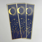 Navy blue bookmarks with gold moon, stars, and hand designs, elegant celestial theme